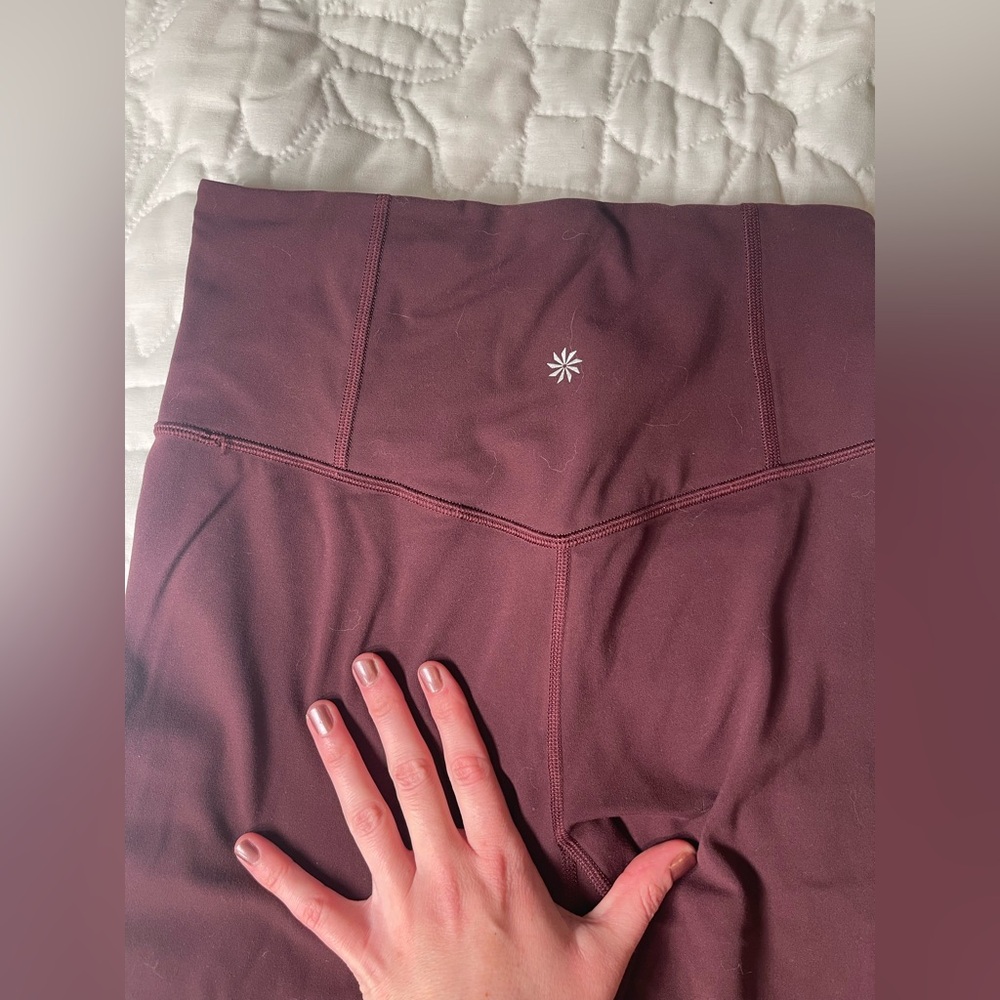 Athleta Salutation boot cut leggings in Cabernet
